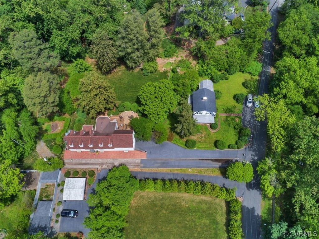 4610 Butte Road Richmond, VA 23235 - Photo 2 of 48 an aerial view of a house with a garden and trees all around