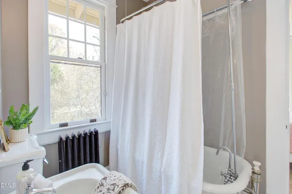 a bathroom with a sink a toilet and tub