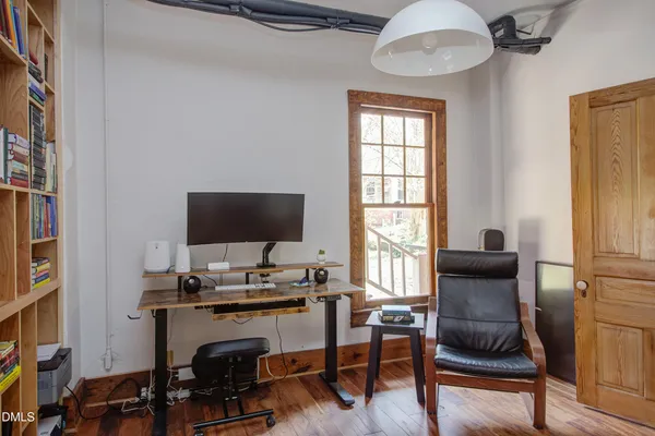 a workspace with furniture and a window