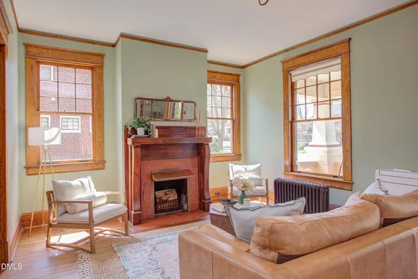 a living room with furniture and a fireplace