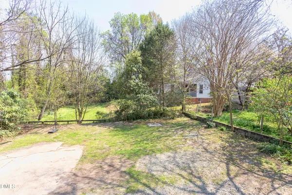 a view of a yard with a tree
