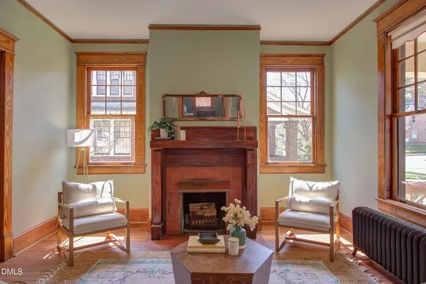 a living room with furniture and a fireplace