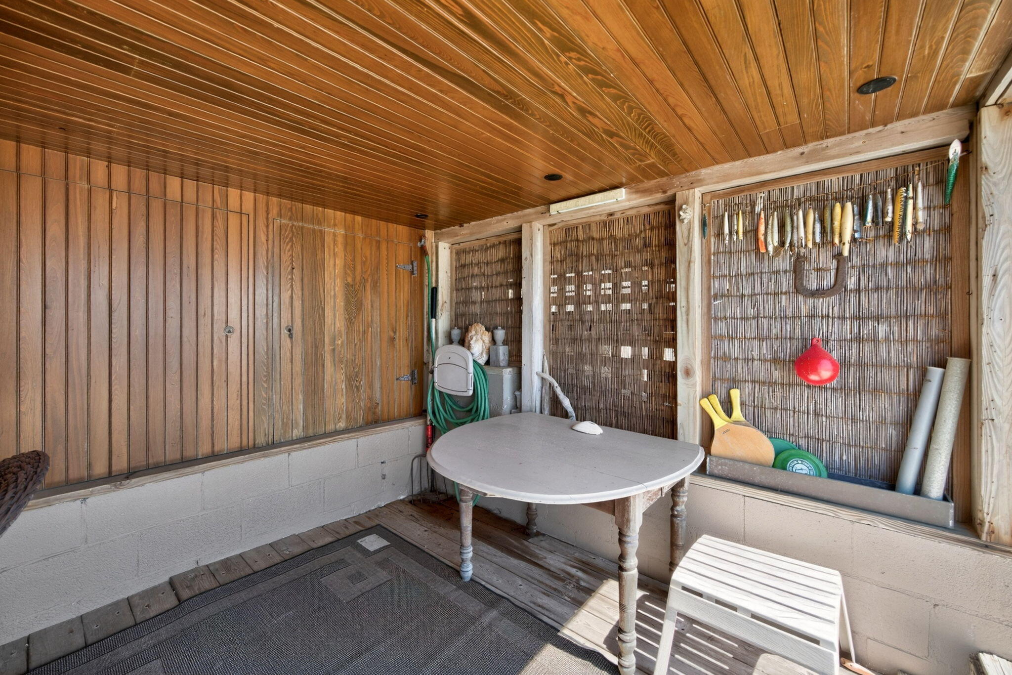 47 Pond Road Truro, MA 02666 - Photo 46 of 55 a outdoor dining space with a table and chairs