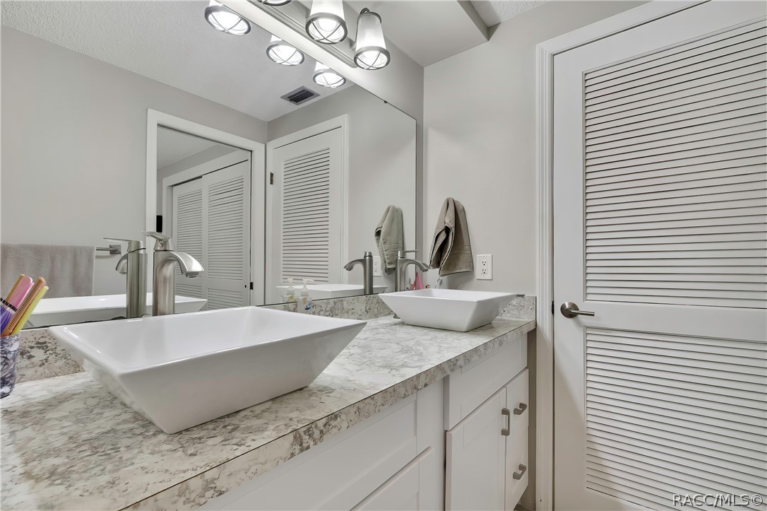 2 Quail Run Homosassa, FL 34446 - Photo 25 of 36 Dual sinks and extra closet in primary bathroom