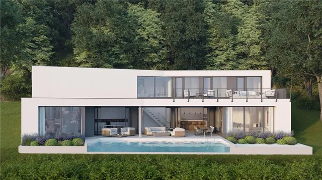 a view of a chair and table in the back yard of the house