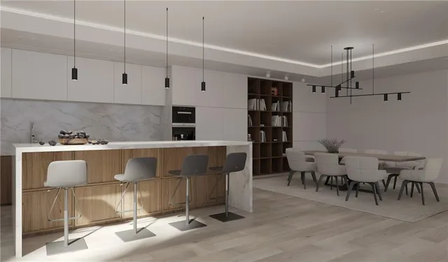 a view of kitchen and dining room with wooden floor