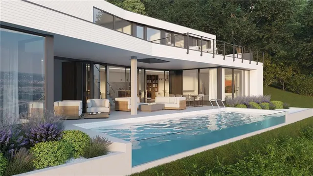 a front view of a house with swimming pool and porch