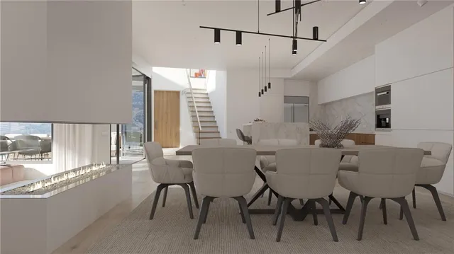 a view of a dining room with furniture and window