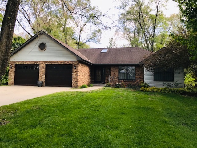 265 Grandin Road Morris, IL 60450 - Photo 1 of 29 a front view of a house with a garden and yard