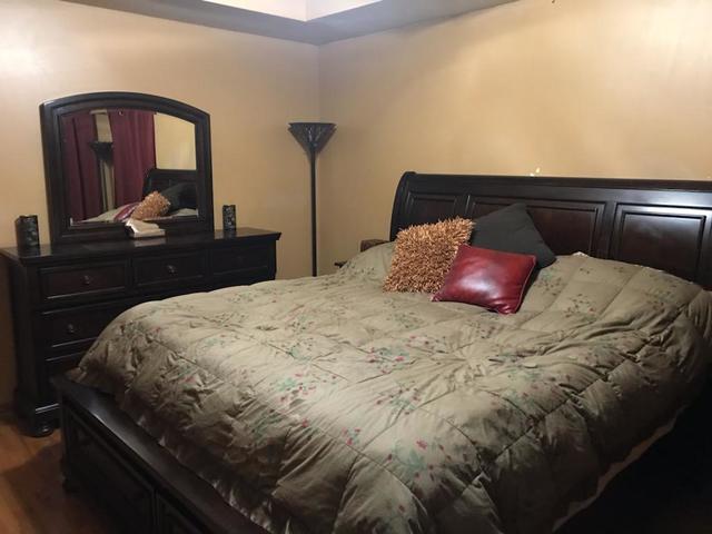 265 Grandin Road Morris, IL 60450 - Photo 11 of 29 a bedroom with a bed and a mirror on dresser