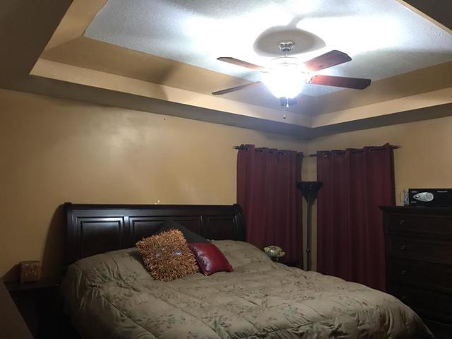 265 Grandin Road Morris, IL 60450 - Photo 12 of 29 a bedroom with a bed and lamp