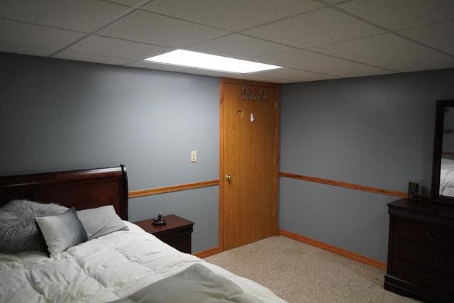 265 Grandin Road Morris, IL 60450 - Photo 23 of 29 a bedroom with a bed and a television