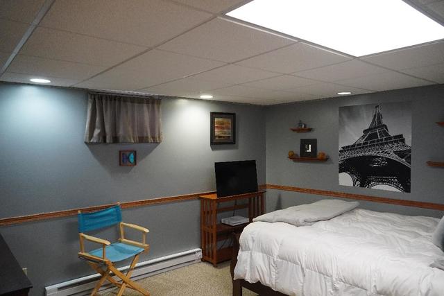 265 Grandin Road Morris, IL 60450 - Photo 24 of 29 a bedroom with a bed and a television