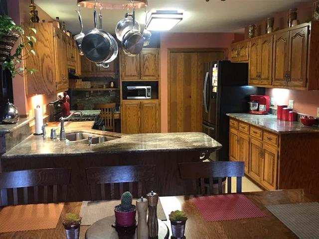 265 Grandin Road Morris, IL 60450 - Photo 6 of 29 a kitchen with sink and refrigerator