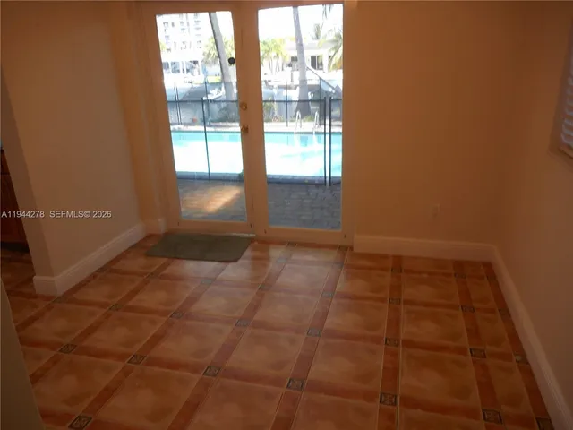 a view of an empty room and window