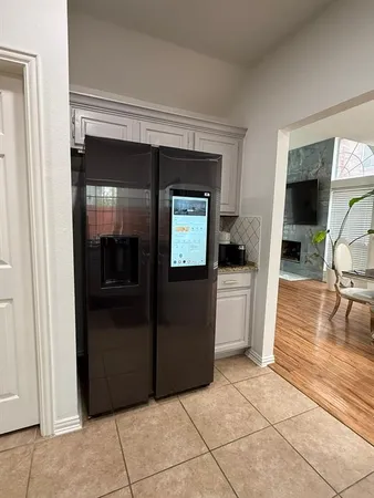 a view of a livingroom with a kitchen