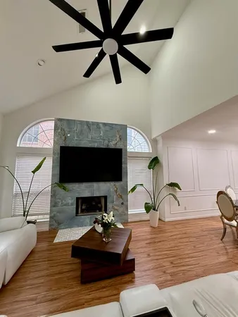 a living room with furniture and a fireplace