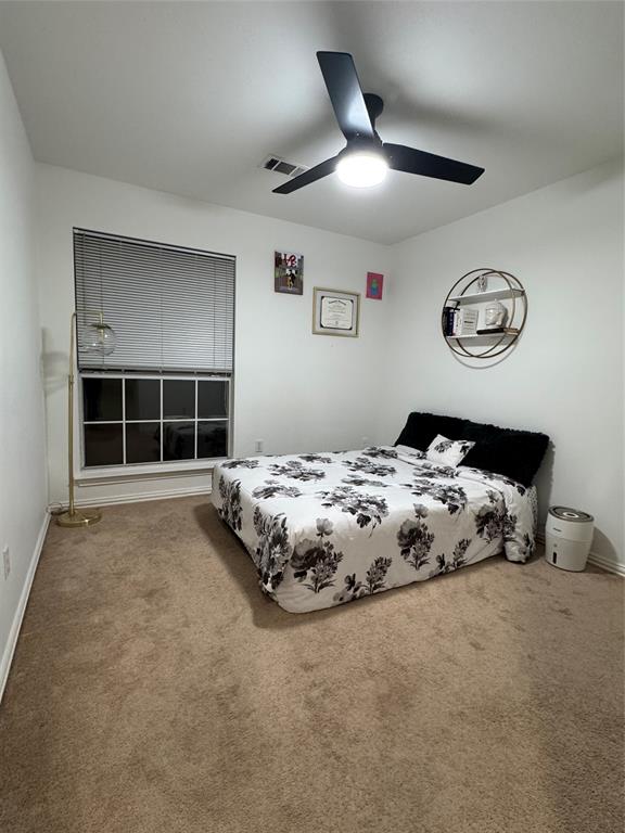417 Moonlight Way Irving, TX 75063 - Photo 23 of 31 a bedroom with a bed and a window