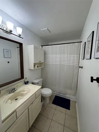 a bathroom with a sink vanity and mirror