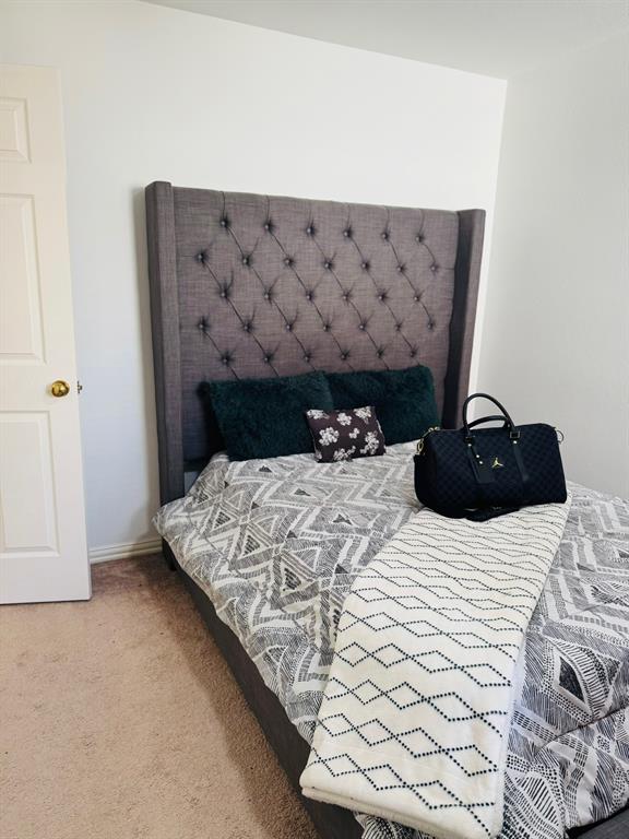 417 Moonlight Way Irving, TX 75063 - Photo 27 of 31 a bedroom with a bed and a couch
