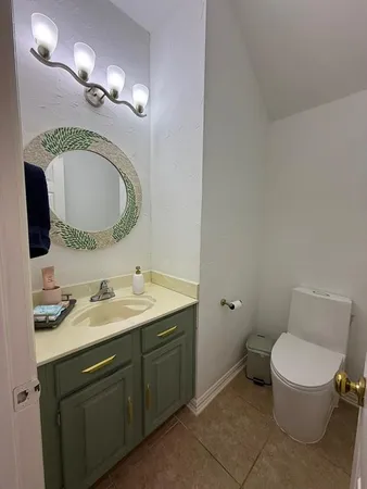 a view of porch with a table and chairs