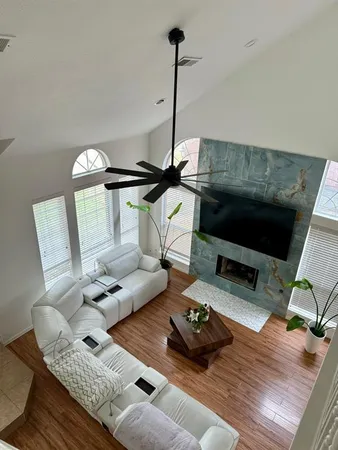 a living room with furniture and a flat screen tv