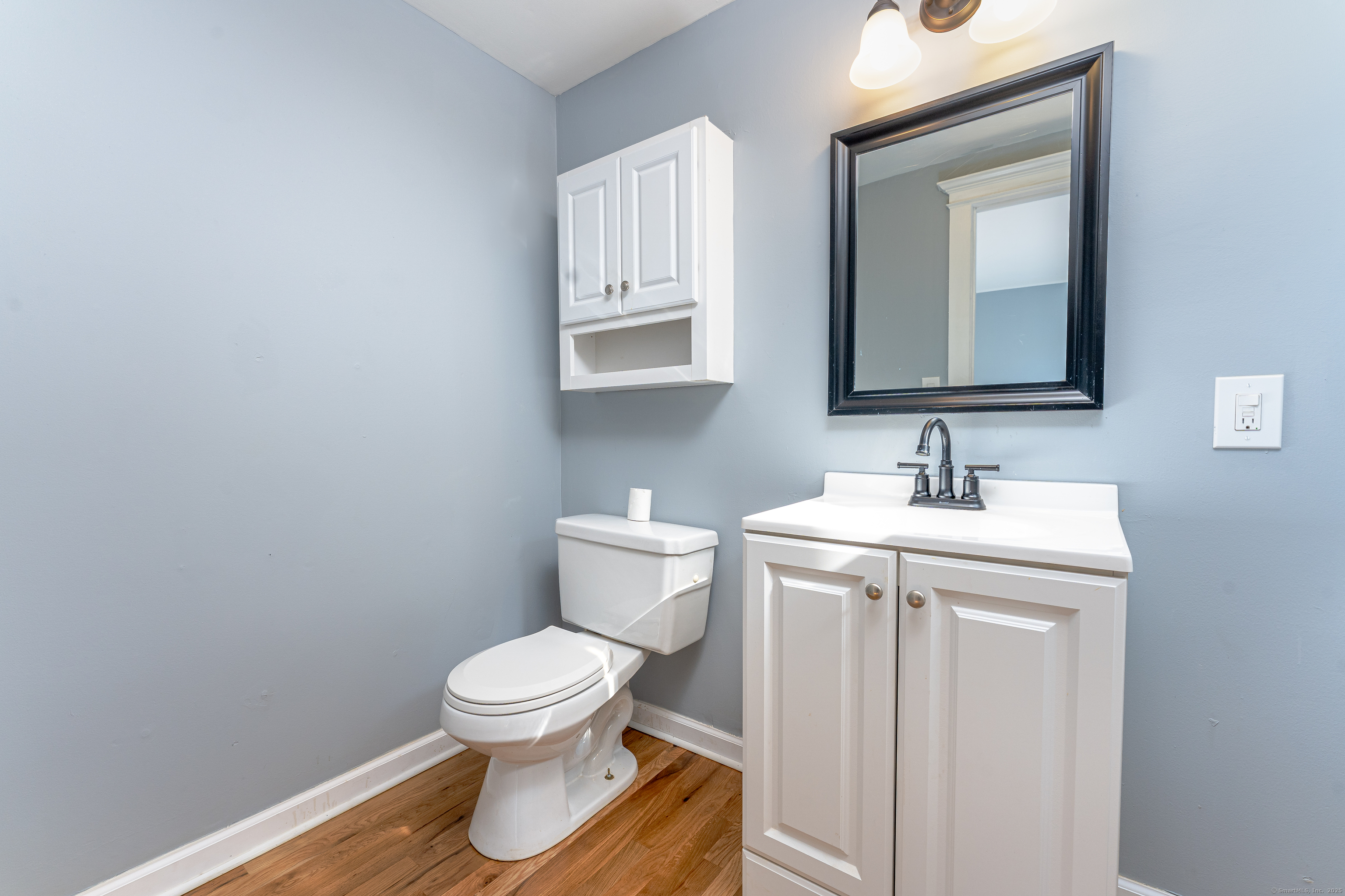 100 Ridgefield Avenue Waterbury, CT 06705 - Photo 16 of 35 a bathroom with a toilet sink and mirror