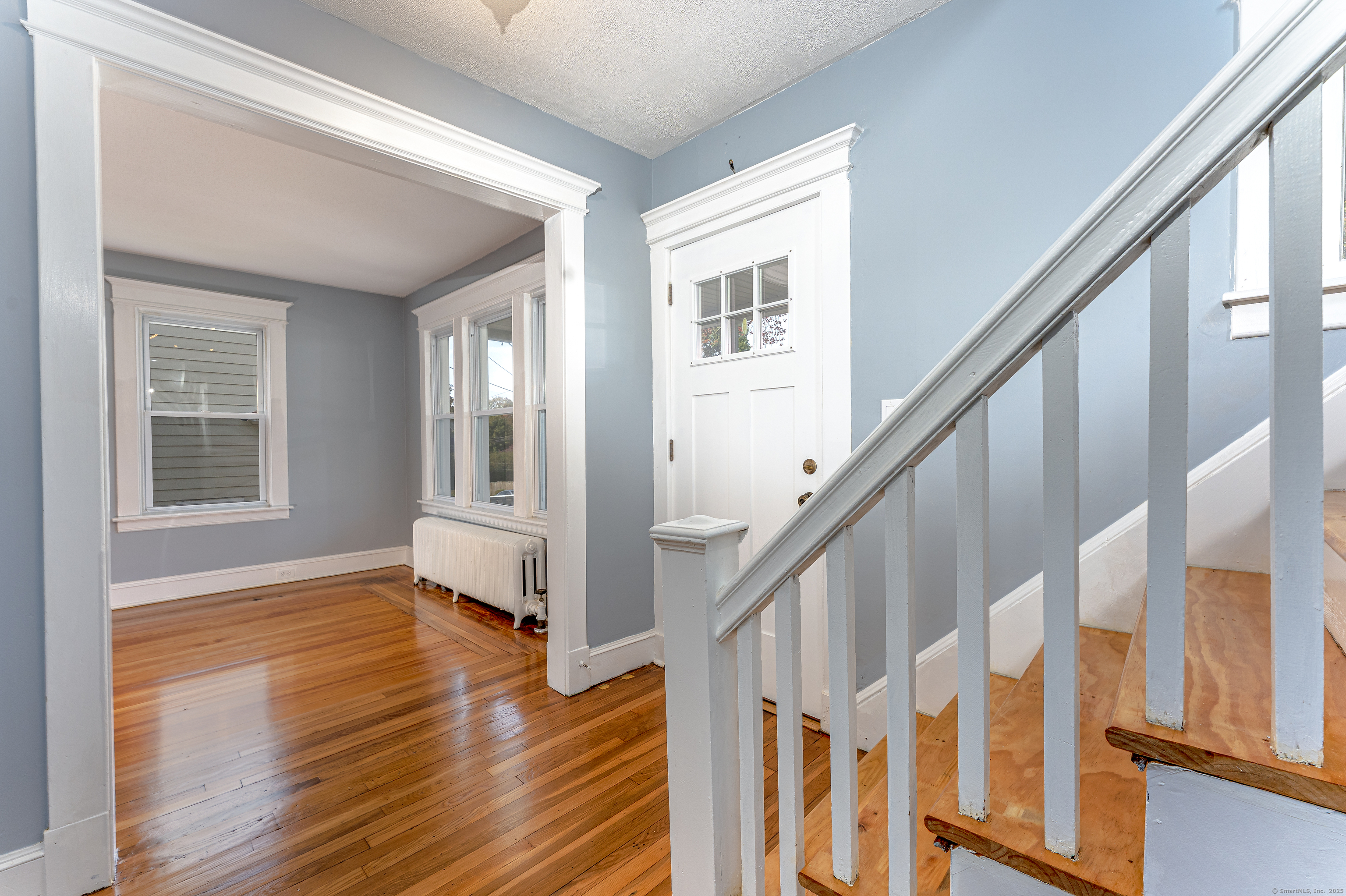 100 Ridgefield Avenue Waterbury, CT 06705 - Photo 17 of 35 a view of an entryway with wooden floor and stairs