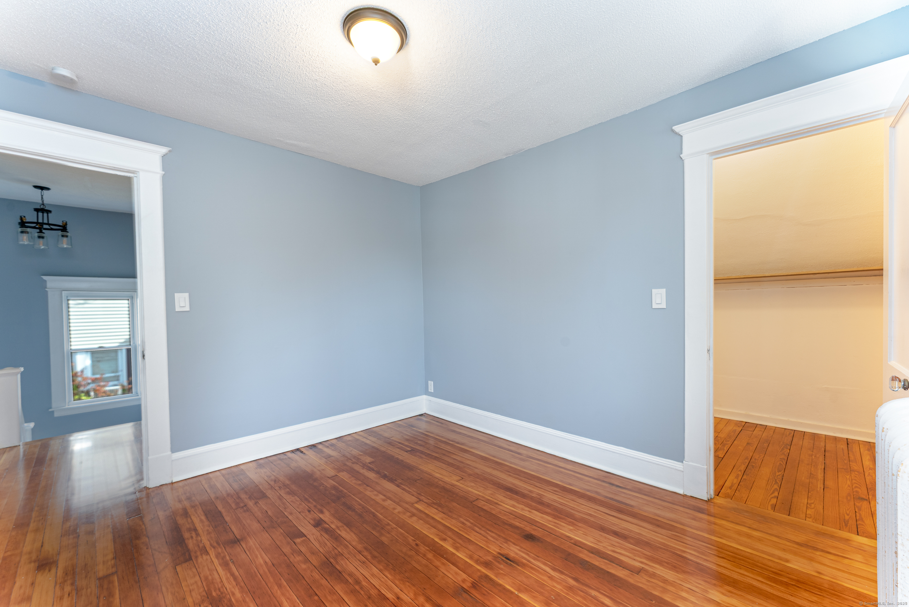 100 Ridgefield Avenue Waterbury, CT 06705 - Photo 22 of 35 wooden floor in an empty room with a window