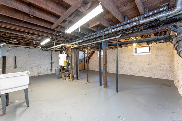 a view of empty room with wooden ceiling