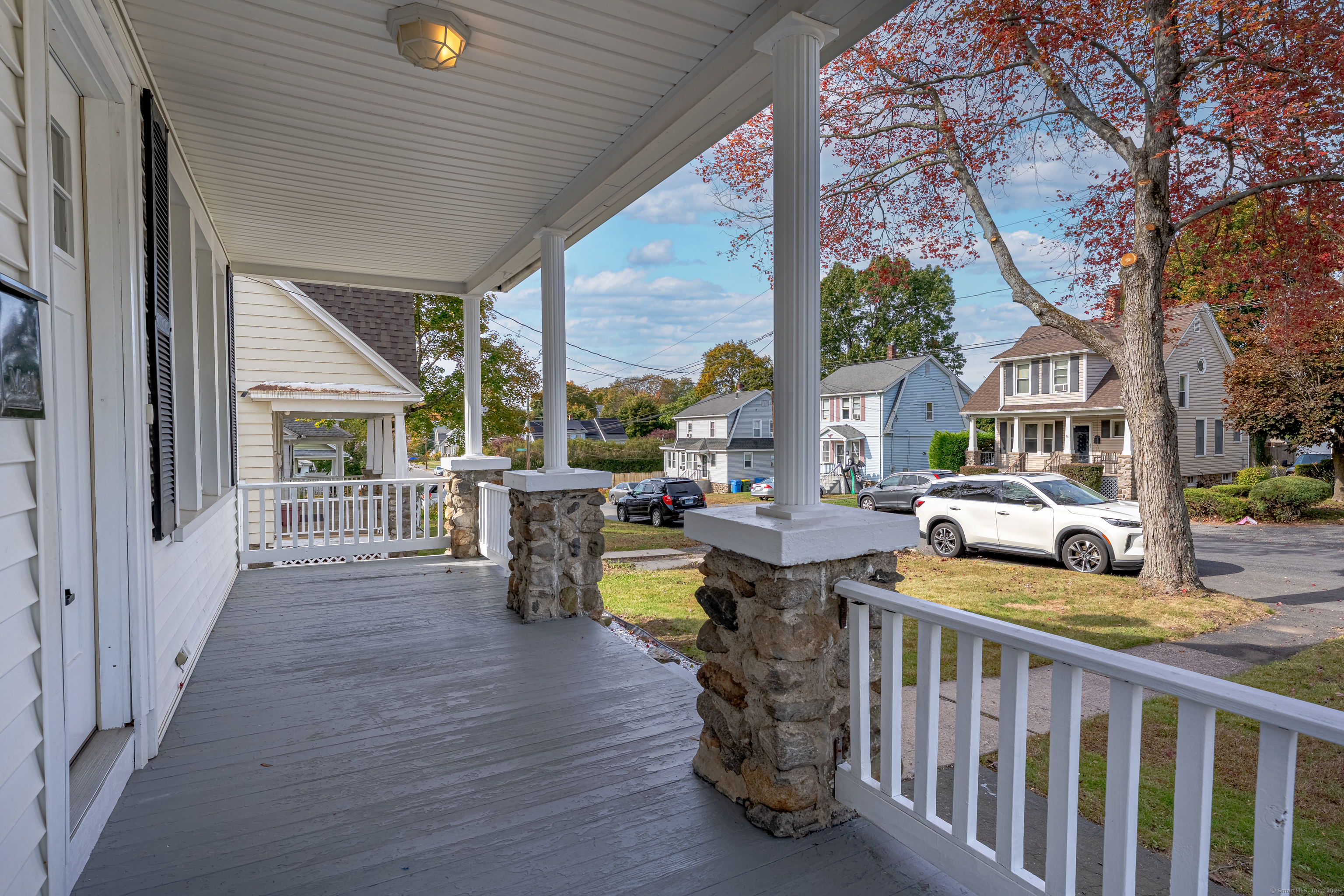 100 Ridgefield Avenue Waterbury, CT 06705 - Photo 33 of 35 a view of a patio with couches chairs and wooden floor