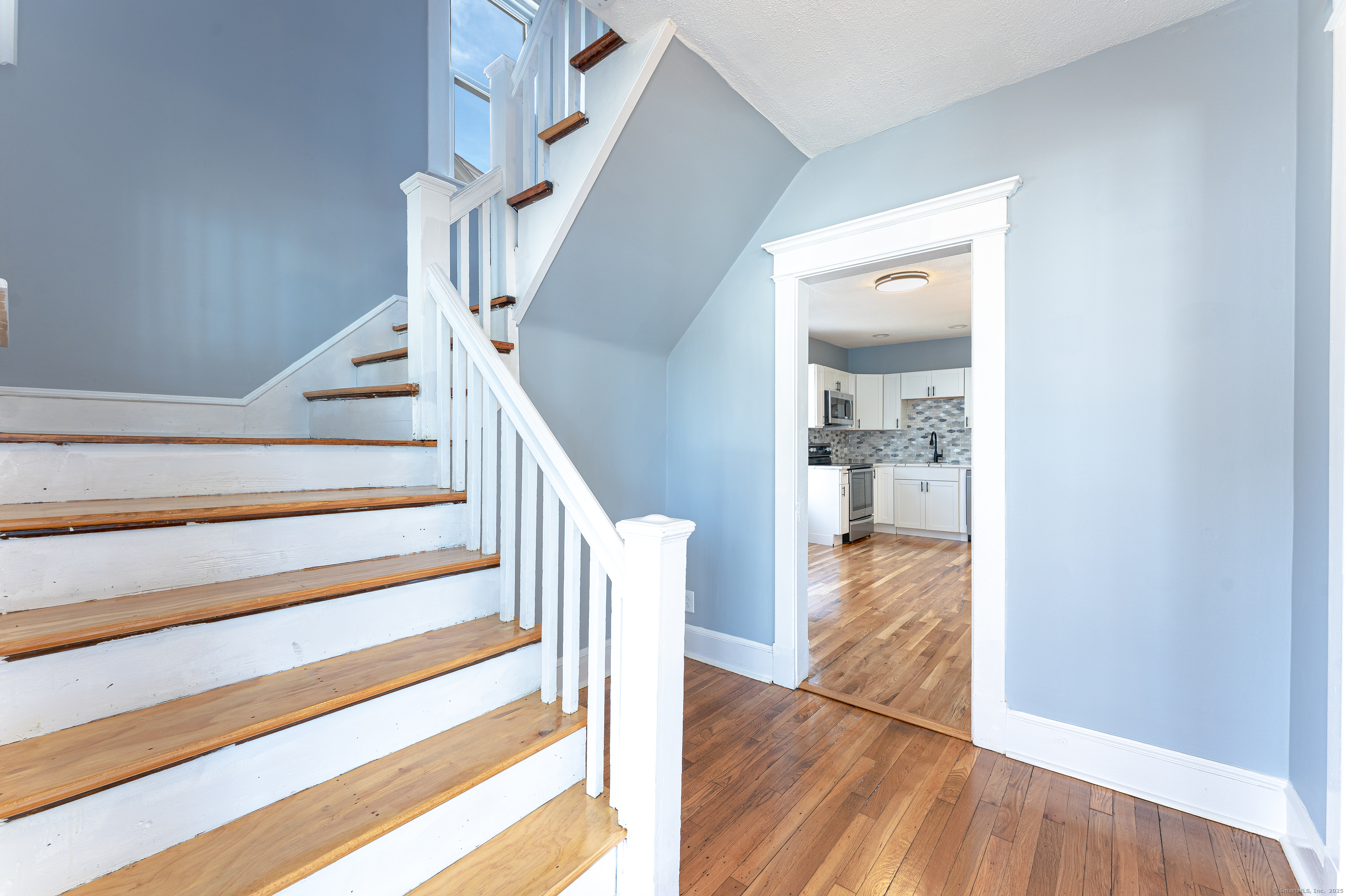 100 Ridgefield Avenue Waterbury, CT 06705 - Photo 5 of 35 a view of entryway and hall with wooden floor
