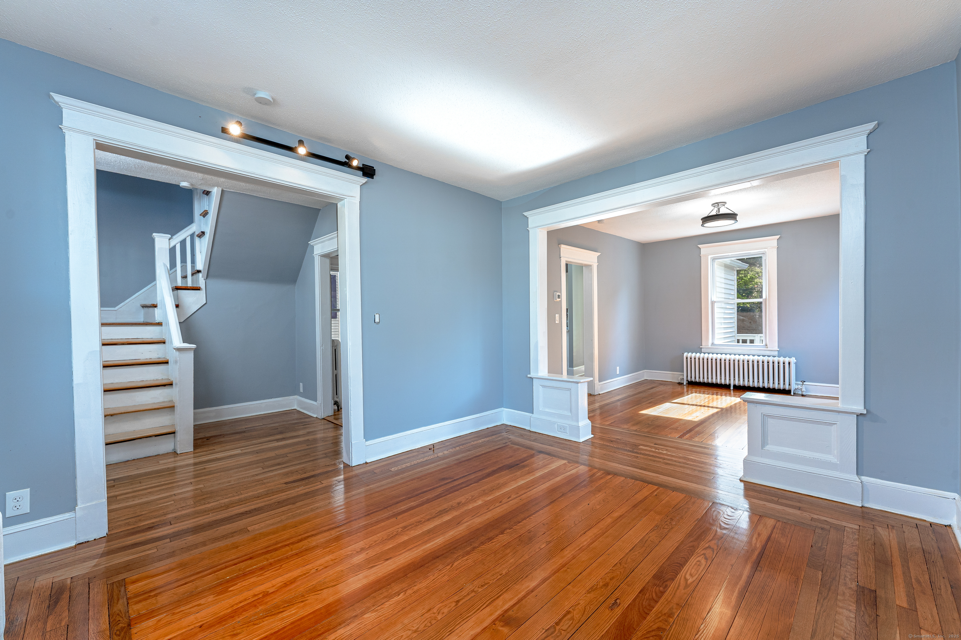 100 Ridgefield Avenue Waterbury, CT 06705 - Photo 7 of 35 wooden floor in an empty room with a window