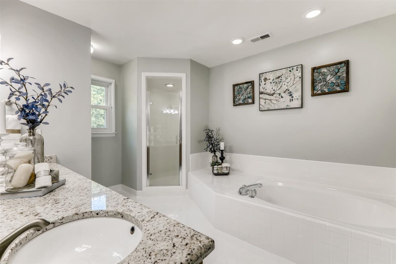 2021 Hamrick Drive Raleigh, NC 27615 - Photo 6 of 13 Owners bath with TILE flooring, large WALK-IN shower, GARDEN TUB and GRANITE top dual vanity. All baths have GRANITE counters! Owners Bath