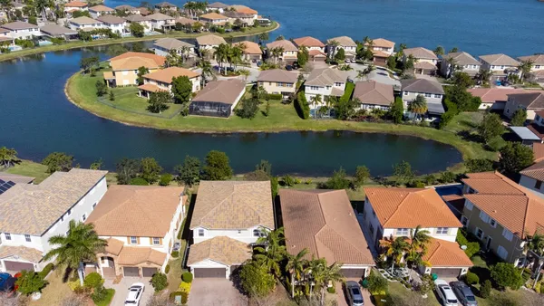 an aerial view of a house with a lake view
