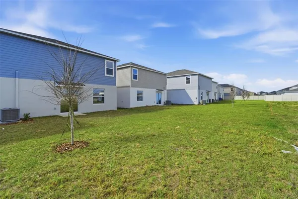 a view of outdoor space with deck and yard