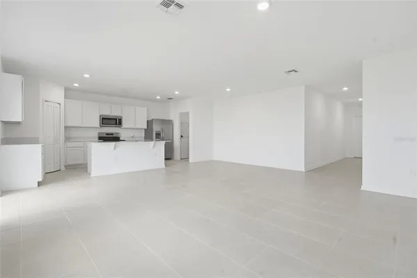 a view of a kitchen with a sink cabinets and a window