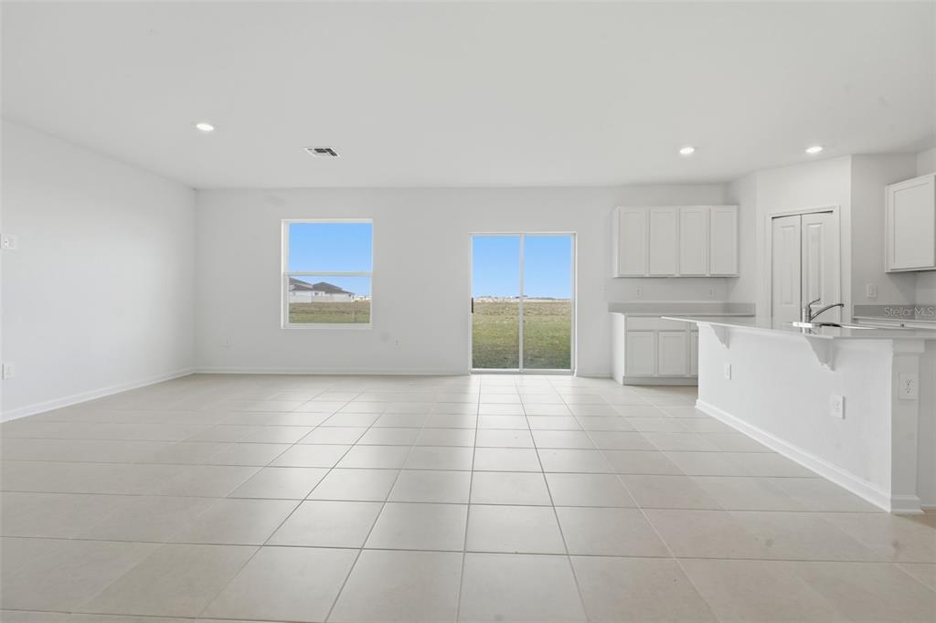2756 Lookout Rdg Road Haines City, FL 33844 - Photo 17 of 53 a view of a kitchen with a sink cabinets and a window