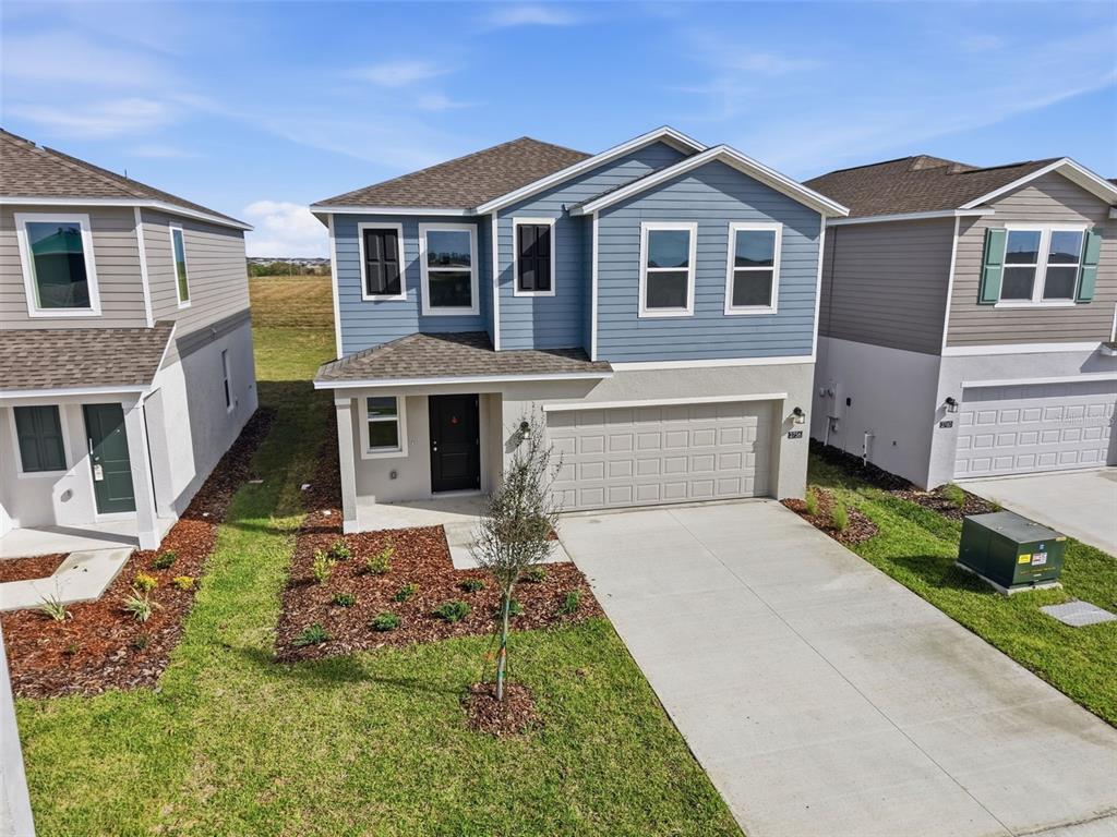 2756 Lookout Rdg Road Haines City, FL 33844 - Photo 4 of 53 a front view of a house with garden