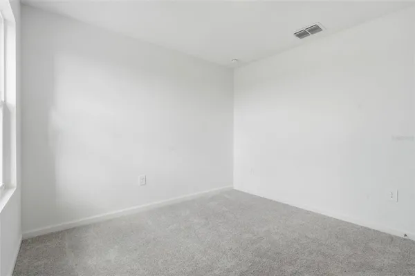 a bathroom with a double vanity sink and mirror