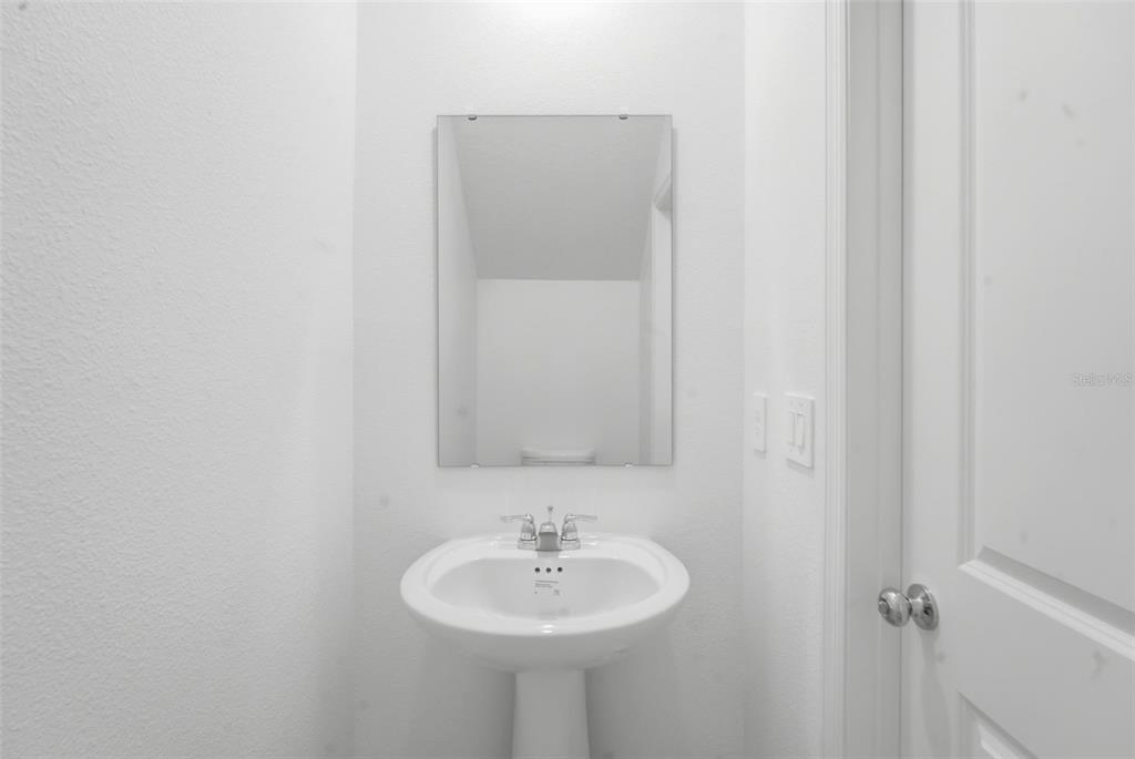 2756 Lookout Rdg Road Haines City, FL 33844 - Photo 48 of 53 a bathroom with a sink and a mirror