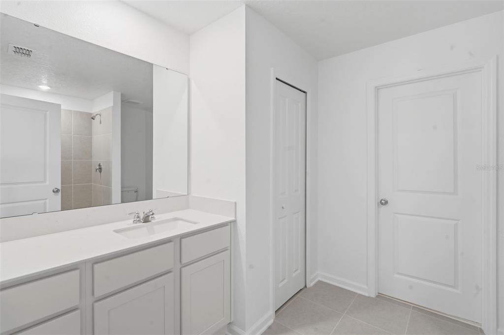 2756 Lookout Rdg Road Haines City, FL 33844 - Photo 49 of 53 a bathroom with a double vanity sink and mirror