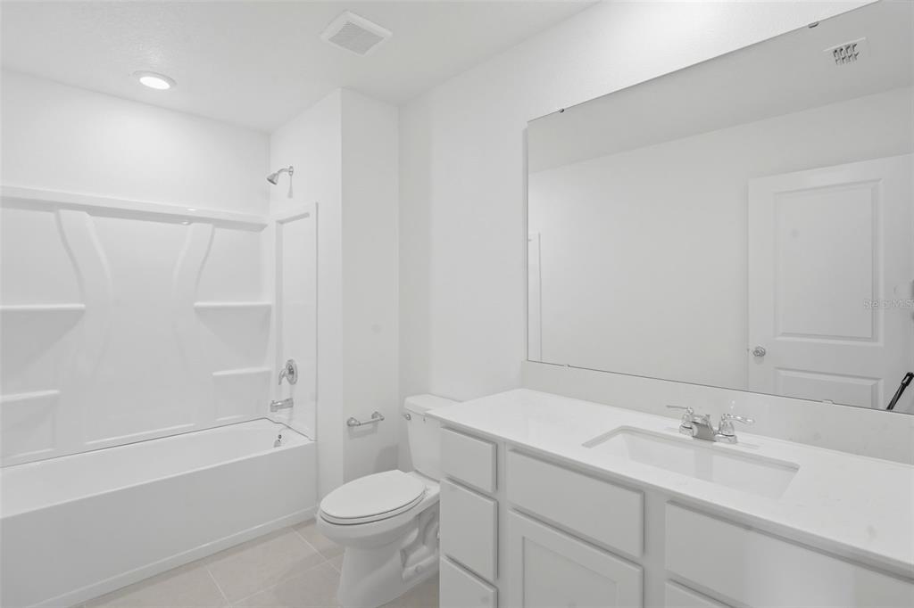 2756 Lookout Rdg Road Haines City, FL 33844 - Photo 52 of 53 a bathroom with a sink a toilet and shower