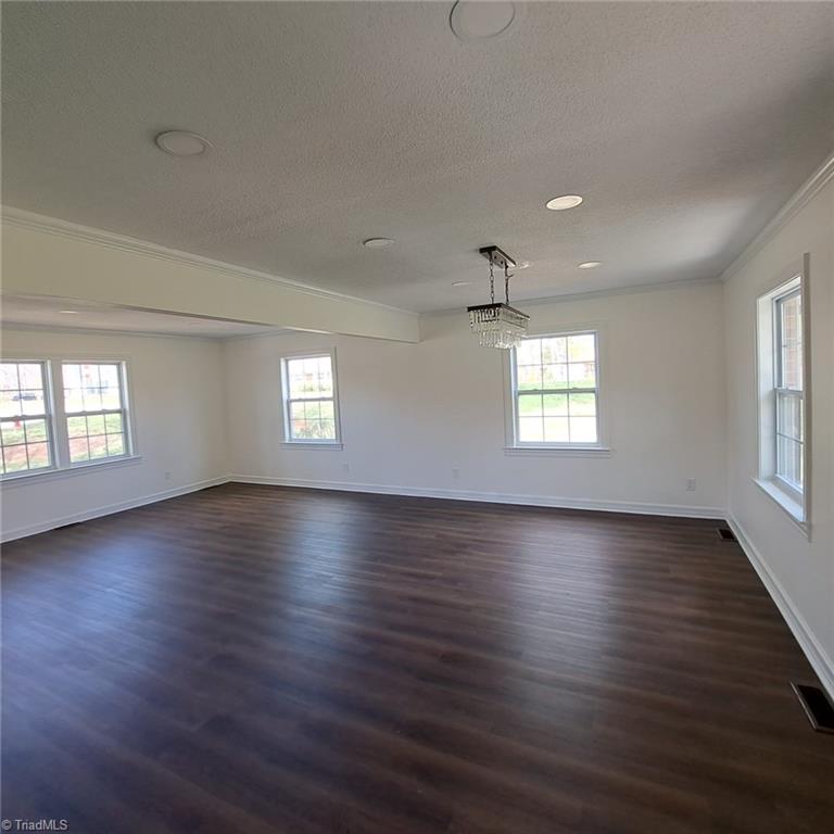 998 Nottingham Road High Point, NC 27262 - Photo 8 of 37 Main level view of living room- dining room from kitchen