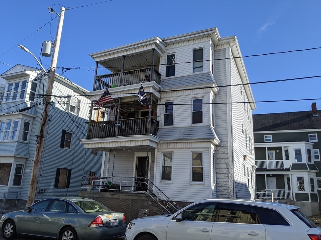 18 John Street Fall River, MA 02721 - Photo 2 of 10 a couple of cars parked in front of a building