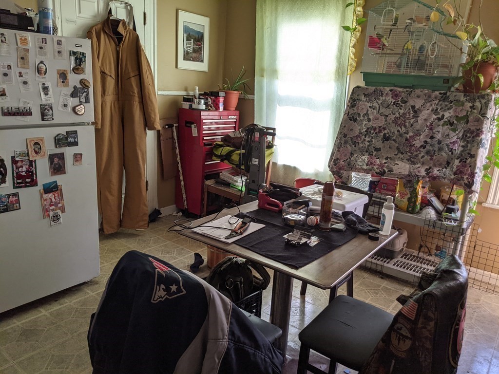 18 John Street Fall River, MA 02721 - Photo 4 of 10 a table and chairs in a room
