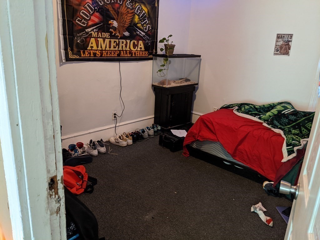 18 John Street Fall River, MA 02721 - Photo 7 of 10 a room with gym equipment and a view of living room