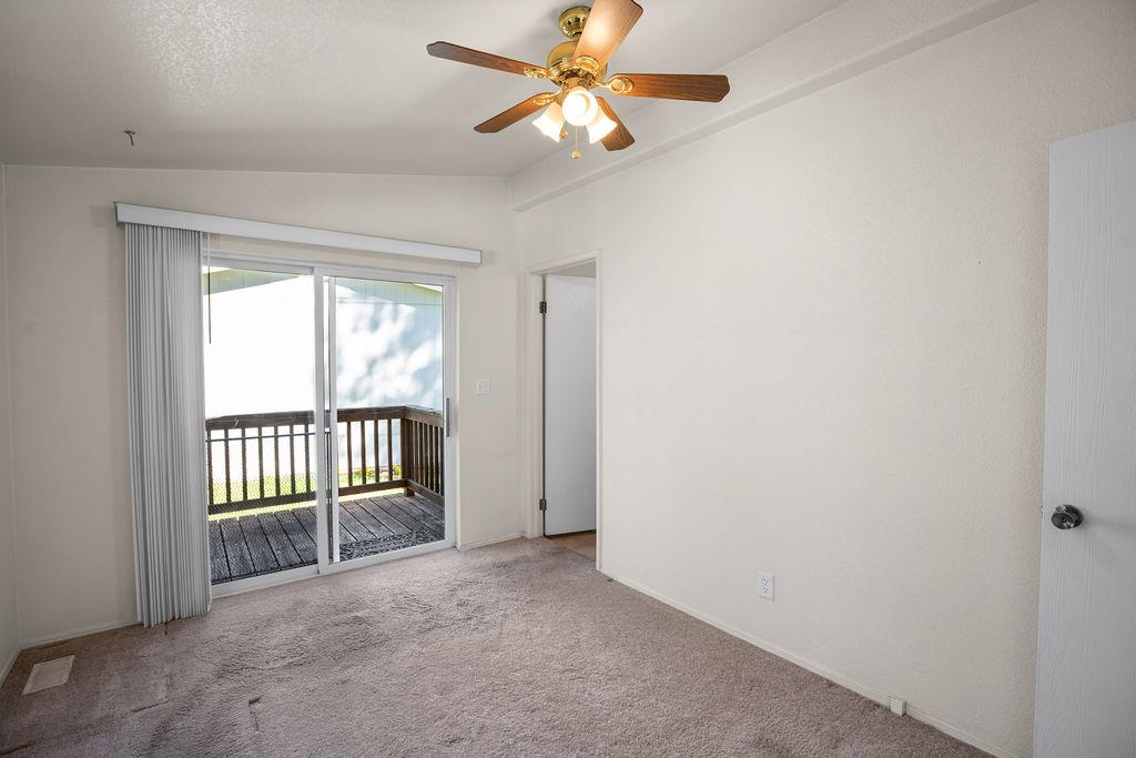 1281 Pleasant Valley Road, Unit 44 Diamond Springs, CA 95619 - Photo 13 of 27 wooden floor in an empty room with a window
