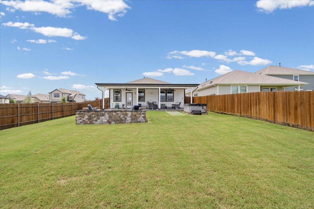 158 Gullivers Drive Elgin, TX 78621 - Photo 26 of 36 Imagine sitting out here roasting marshmallows under the stars or soaking in the hot tub.