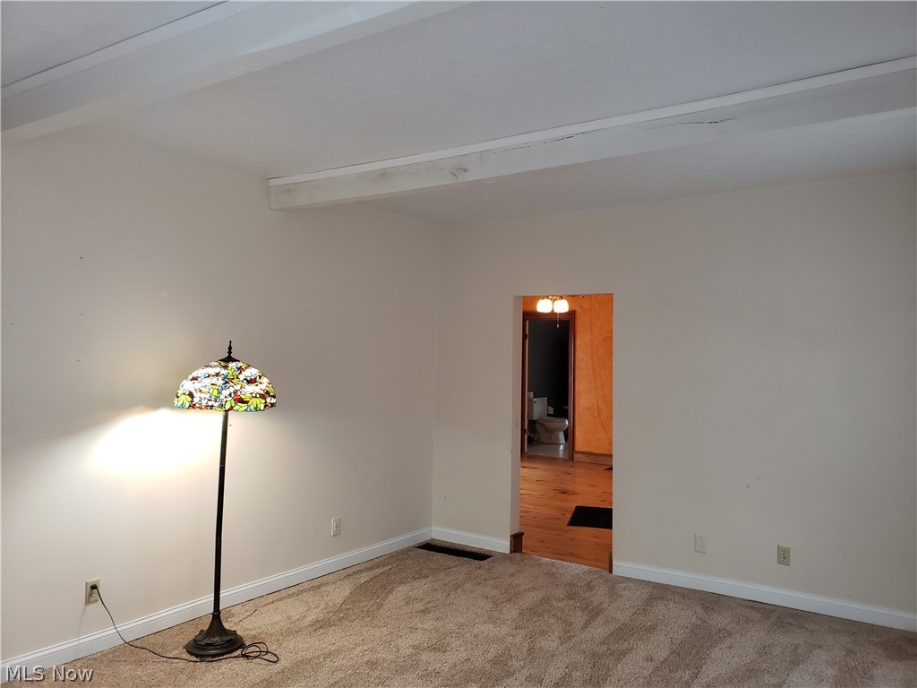 2163 Dock Road Madison, OH 44057 - Photo 18 of 35 alt view of living room with accent beams
